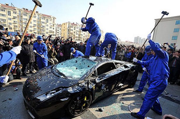 workers-destroy-a-lamborghini-gallardo-pic-afp-getty-images-885436248.jpg