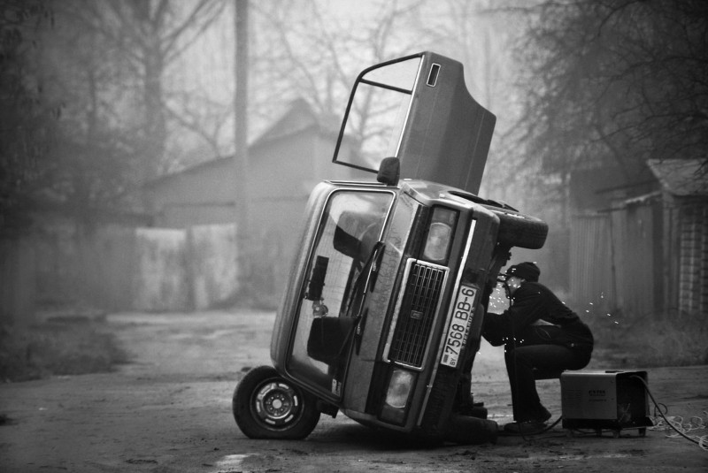 man-repairing-the-old-soviet-car-on-the-outskirts-of-the-city-of-mogilev-in-eastern-belarus-by-mihail-kopychko.jpg